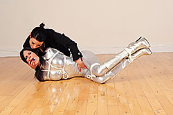 Ashley in silver catsuit & boot tied up by JJplush